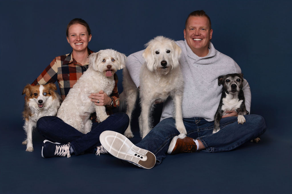 Jake and Jess Rebo with their four dogs